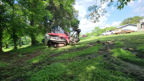 PLAYING IN THE DIRT: SON FILMS FATHER USING THE SKIDSTEER FOR THE FIRST TIME
