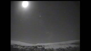 Meteor next to the moon