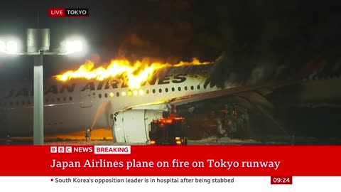 Japan Airlines plane in flames on the runway at Tokyo's Haneda Airport