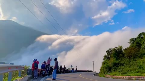 Clouds fall down the beautiful mountains