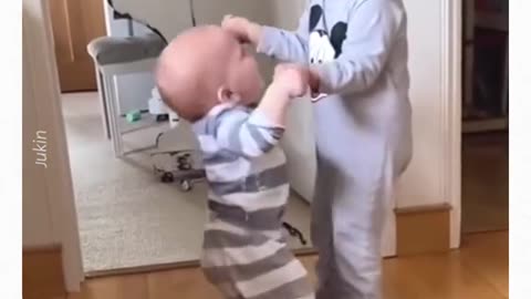 Toddler Helps Baby Brother Walk Around the House..😚😄