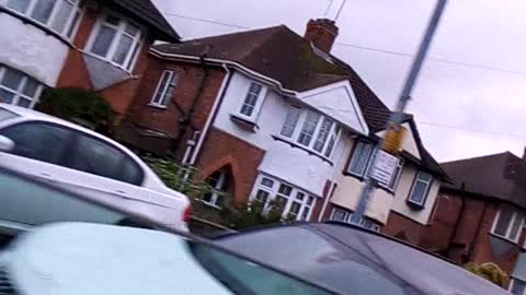 Beautiful houses view while driving in the car in the UK