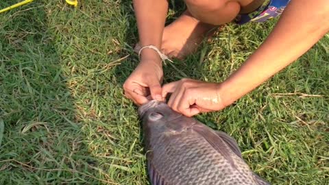 Boy Catches Fish...With A Toy Fishing Pole