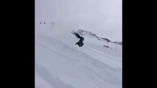 Snowboard mid backflip faceplant