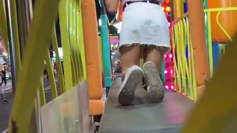 Carnival Ride Hilariously Traps Woman On Moving Walkway