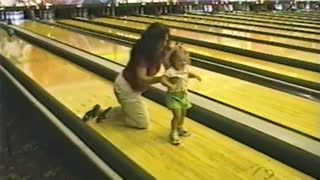 Mom And Daughter Slip And Fall Chasing A Bowling Ball