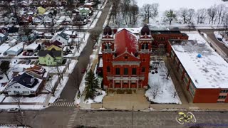 Aerial video of Basilica of St Adalbert and Sacred Heart of Jesus Church in Grand Rapids Michigan