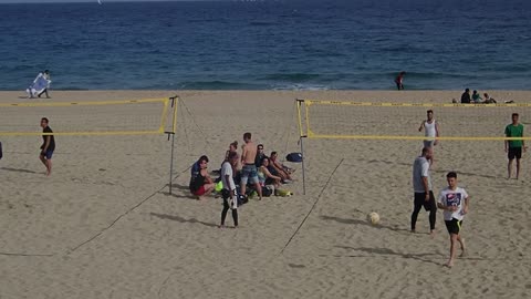 Record Of People Playing Volleyball At The Beach