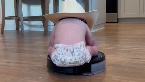 Baby Cowboy Rides a Roomba