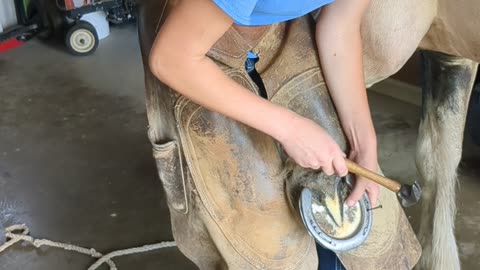 Kendalyn (14) pounding a horse nail in - 23 Aug 2023