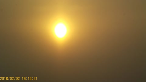 Time-Lapse beautiful sunset through the clouds