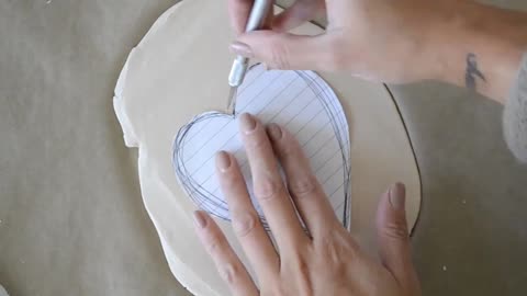 Take a piece of clay and follow the pattern of a heart
