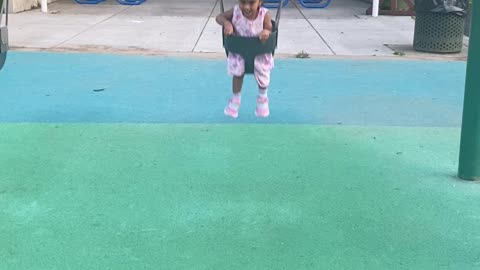 Baby enjoying swinging