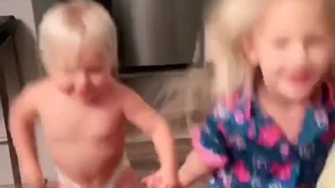 Two children dancing