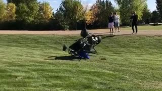 Man in four wheeler flips the guy in blue falls out