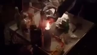 Music guy sprays fire at friend