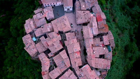 Tourist Attractions A small town built on top of a hill in Italy, surrounded by cliffs