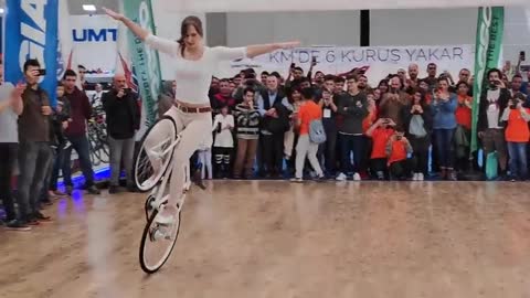 Girl Biker Performs