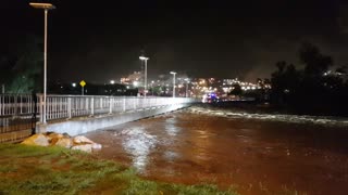 River Rises Rapidly Over Bridge After Heavy Rain