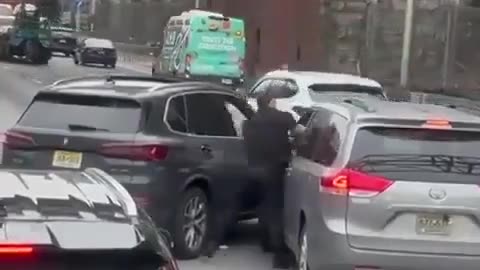 BMW driver blocks a smaller vehicle being driven by an elderly Asian man,