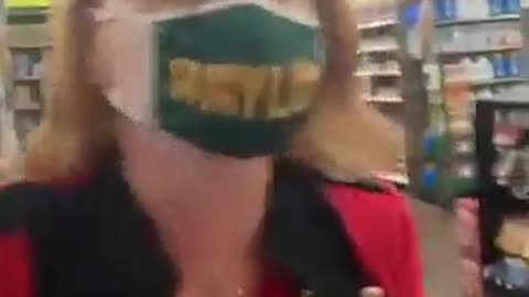 Woman harasses a couple in a supermarket and makes out they're crazy for not wearing face masks.