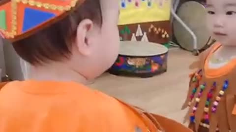 a baby in the mirror