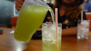 Green Tea Pouring slow motion close up shot