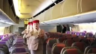 Red hat cabin crew dancing three ladies