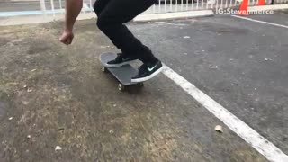 Guy trick over white rail falls