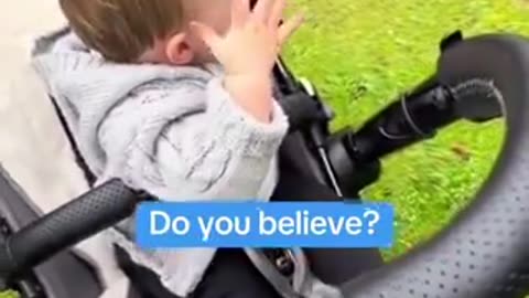 What does this WAVING baby SEE at his GRANDFATHER'S GRAVE???