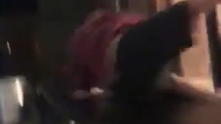 Guy red shirt jumps on black table doesnt break