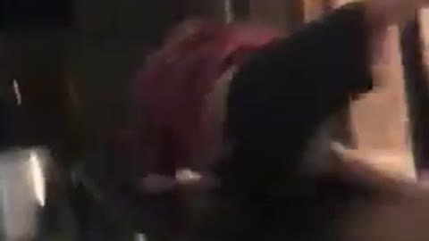 Guy red shirt jumps on black table doesnt break