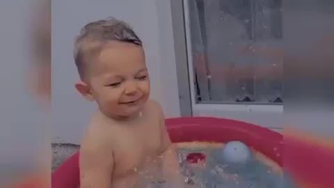 This child have fun in a small pool