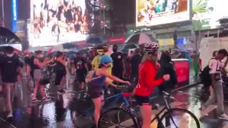 Car seen driving through group of protesters in Times Square