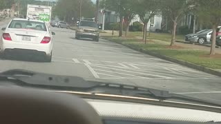 Driving in Reverse Through Town