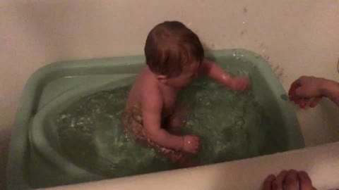 little boy bathes in the bathroom