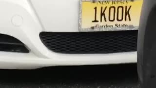1kook yellow license plate on white car