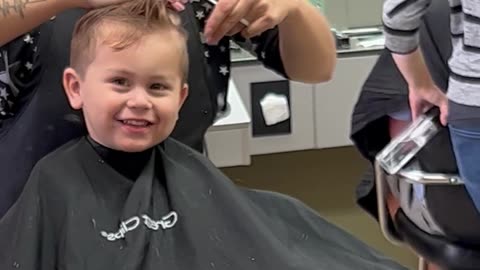 Son Practices His Best Blue Steel During Haircut