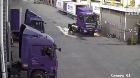 Man thinks he is strong enough to stop a rolling semi truck.