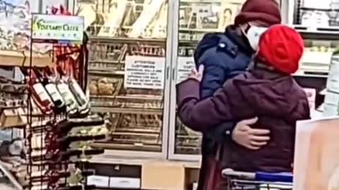 Elderly couple caught slow dancing at the grocery store