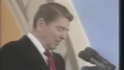 President Reagan reacts to a balloon popping during his speech in 1987