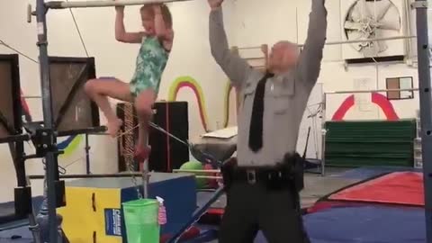 7-year-old gymnast challenges state trooper to pull-up challenge
