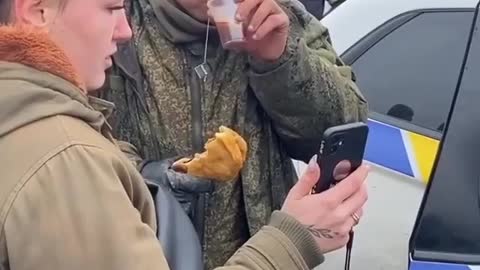 Russian soldiers weeps after Ukraine's feed him food and let him call home
