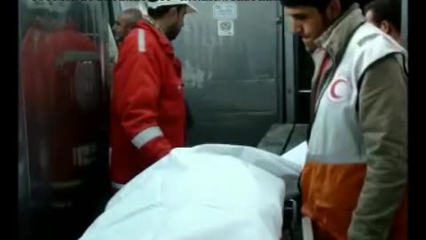 Recovering the body parts of a Palestinian woman killed by Israeli drone strike (2009)
