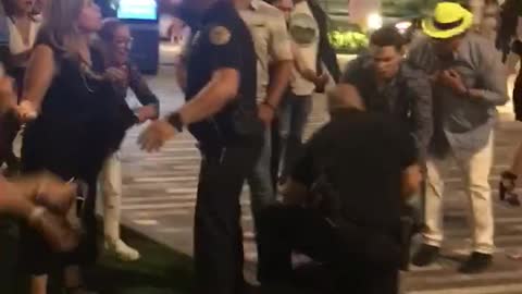 Woman Uses Her Heel to Hit Cop