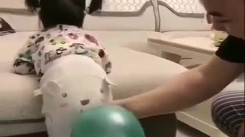 Funny baby...The new way to baloon blowing