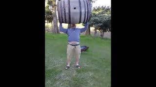 Picking up a wine barrel