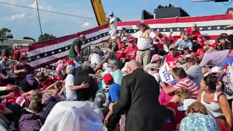 Bloodied Person Carried Away From Stands Following Shooting at Trump Rally