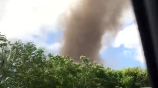 Car Approaches Massive Tornado