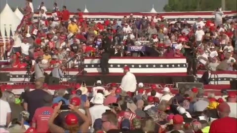 Video shows Trump stand up with blood on face after gunshots fired at rally